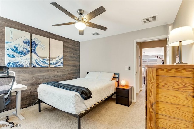 6624 Palmerston Dr, Fort Myers, FL 33966 - bedroom with light colored carpet, a ceiling fan, and wood walls
