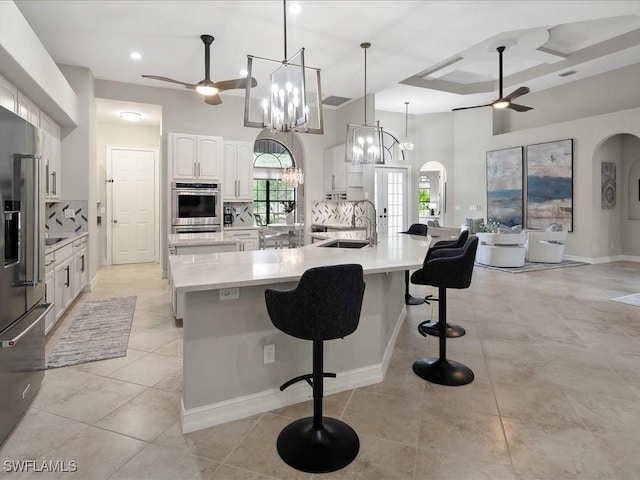 2360 19th St SW, Naples, FL 34117 - kitchen featuring a ceiling fan, appliances with stainless steel finishes, a sink, a large island, and recessed lighting