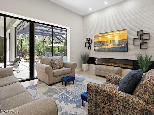 2360 19th St SW, Naples, FL 34117 - tiled living room with recessed lighting, a glass covered fireplace, and baseboards