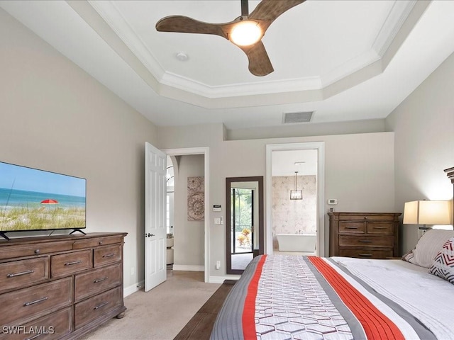 2360 19th St SW, Naples, FL 34117 - bedroom featuring a raised ceiling, ensuite bathroom, crown molding, ceiling fan, and baseboards