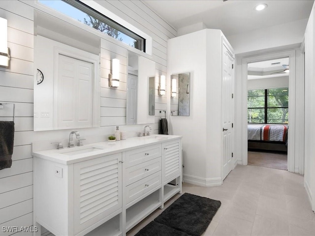 2360 19th St SW, Naples, FL 34117 - ensuite bathroom featuring double vanity, recessed lighting, and baseboards