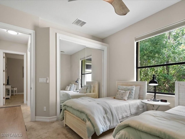 2360 19th St SW, Naples, FL 34117 - bedroom with light colored carpet, baseboards, and a ceiling fan