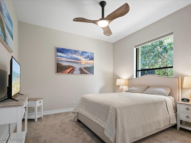 2360 19th St SW, Naples, FL 34117 - bedroom featuring light carpet, baseboards, and ceiling fan