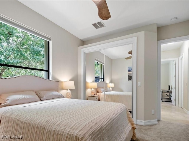 2360 19th St SW, Naples, FL 34117 - bedroom featuring light carpet, baseboards, a ceiling fan, and a closet