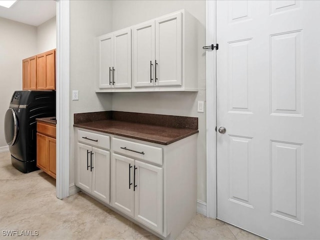 2360 19th St SW, Naples, FL 34117 - laundry room with cabinet space, washer / dryer, and baseboards