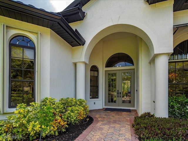 2360 19th St SW, Naples, FL 34117 - entrance to property featuring french doors and stucco siding