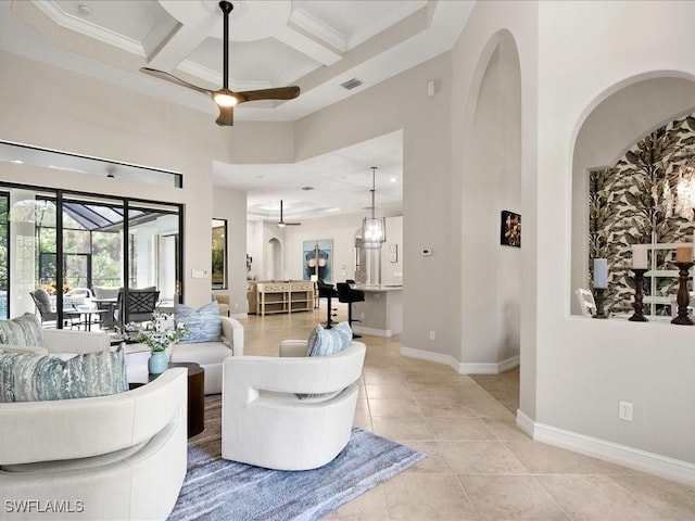 2360 19th St SW, Naples, FL 34117 - living area featuring a high ceiling, a ceiling fan, coffered ceiling, light tile patterned floors, and baseboards