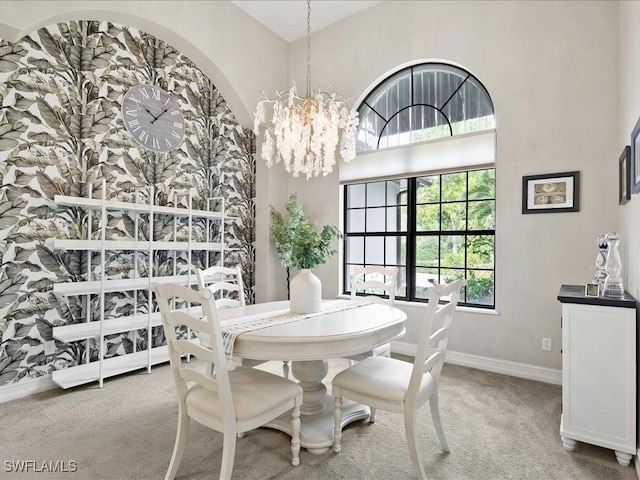 2360 19th St SW, Naples, FL 34117 - dining area featuring carpet, a chandelier, and baseboards