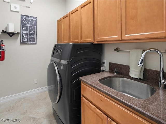 2360 19th St SW, Naples, FL 34117 - laundry area with washer / dryer, cabinet space, baseboards, and light tile patterned floors