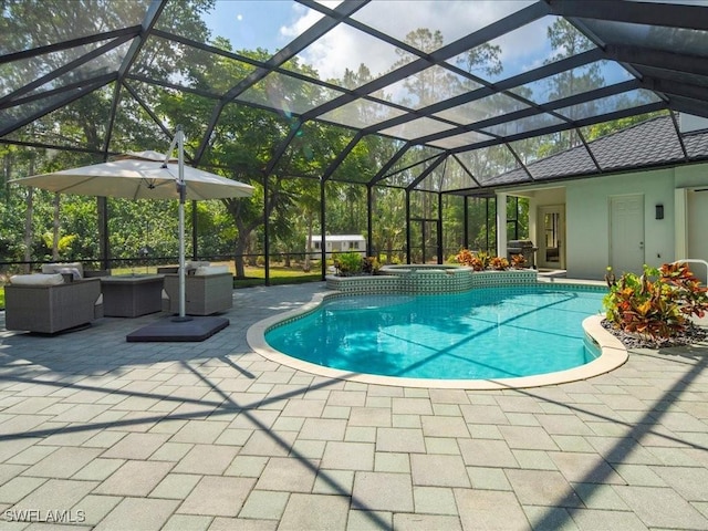 2360 19th St SW, Naples, FL 34117 - view of pool featuring a patio, outdoor lounge area, a pool with connected hot tub, and a lanai