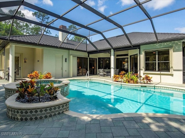 2360 19th St SW, Naples, FL 34117 - view of swimming pool with a patio area, a pool with connected hot tub, and a lanai