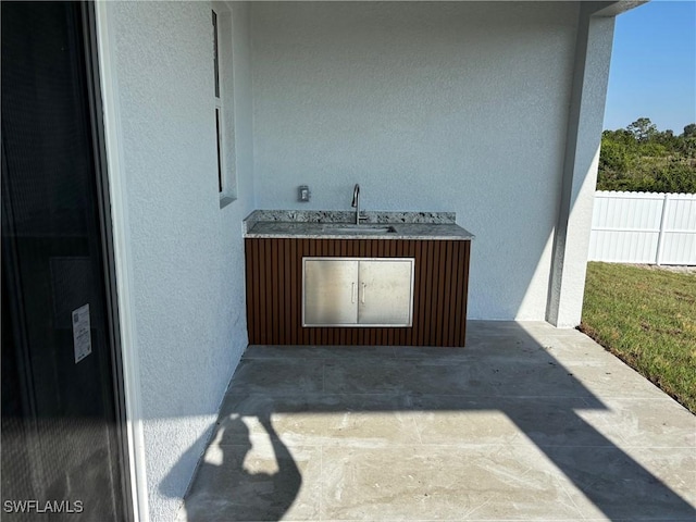951 Commodore St, Lehigh Acres, FL 33974 - exterior view of a sink and stucco siding