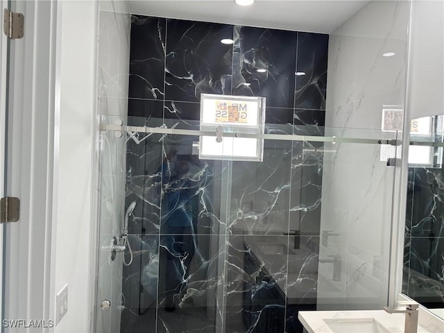 951 Commodore St, Lehigh Acres, FL 33974 - bathroom with a marble finish shower, vanity, and plenty of natural light