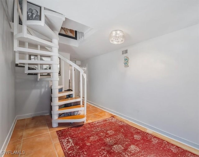 434 Leawood Cir, Naples, FL 34104 - staircase featuring tile patterned floors and baseboards