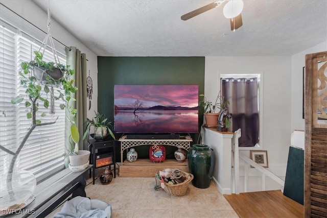 434 Leawood Cir, Naples, FL 34104 - living room with ceiling fan, tile patterned flooring, and a textured ceiling