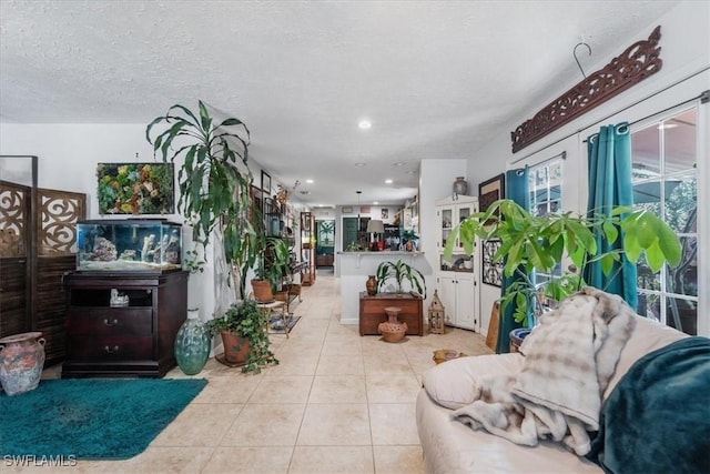 434 Leawood Cir, Naples, FL 34104 - living area with light tile patterned floors, recessed lighting, and a textured ceiling