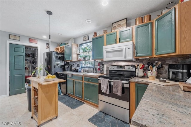 434 Leawood Cir, Naples, FL 34104 - kitchen with appliances with stainless steel finishes, decorative backsplash, a textured ceiling, light tile patterned floors, and hanging light fixtures