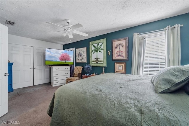 434 Leawood Cir, Naples, FL 34104 - bedroom with carpet flooring, a textured ceiling, ceiling fan, and a closet