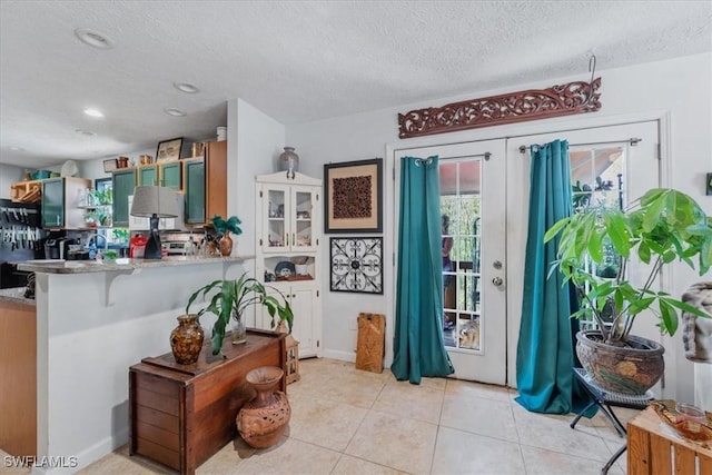 434 Leawood Cir, Naples, FL 34104 - entryway featuring a textured ceiling, light tile patterned flooring, and recessed lighting