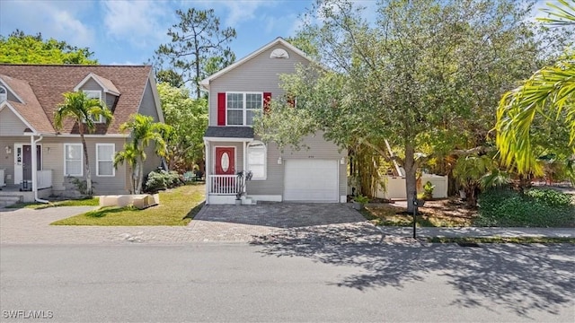 434 Leawood Cir, Naples, FL 34104 - view of front facade with driveway and an attached garage