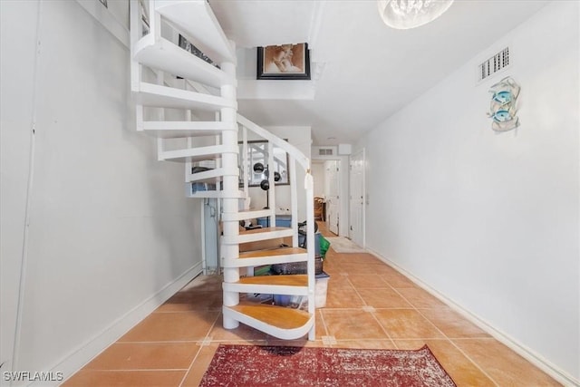 434 Leawood Cir, Naples, FL 34104 - staircase with tile patterned floors and baseboards