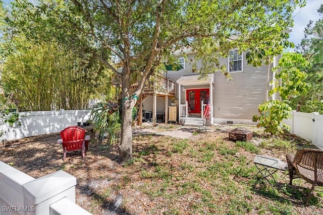 434 Leawood Cir, Naples, FL 34104 - view of front of house featuring a fenced backyard, french doors, a fire pit, and crawl space