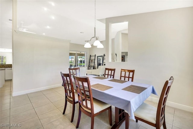 3317 SW 5th Pl, Cape Coral, FL 33914 - dining space featuring light tile patterned floors and a chandelier