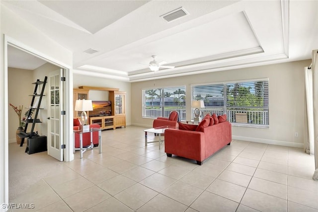3317 SW 5th Pl, Cape Coral, FL 33914 - living area featuring a tray ceiling, a ceiling fan, and light tile patterned flooring