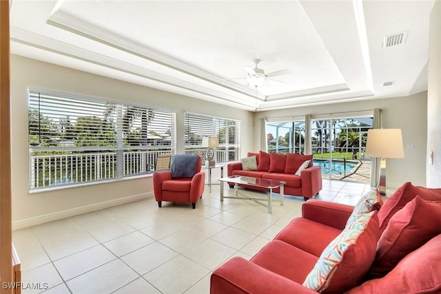 3317 SW 5th Pl, Cape Coral, FL 33914 - tiled living area featuring a raised ceiling and a ceiling fan