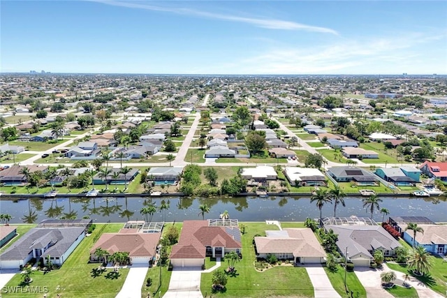 3317 SW 5th Pl, Cape Coral, FL 33914 - aerial perspective of suburban area featuring a nearby body of water