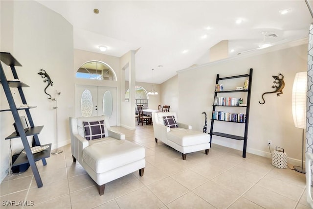 3317 SW 5th Pl, Cape Coral, FL 33914 - living room featuring vaulted ceiling and light tile patterned floors