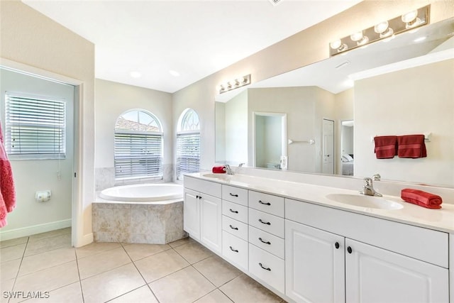 3317 SW 5th Pl, Cape Coral, FL 33914 - bathroom with double vanity, a bath, and tile patterned floors