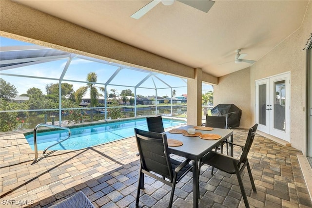 3317 SW 5th Pl, Cape Coral, FL 33914 - swimming pool with ceiling fan, a grill, french doors, and a patio