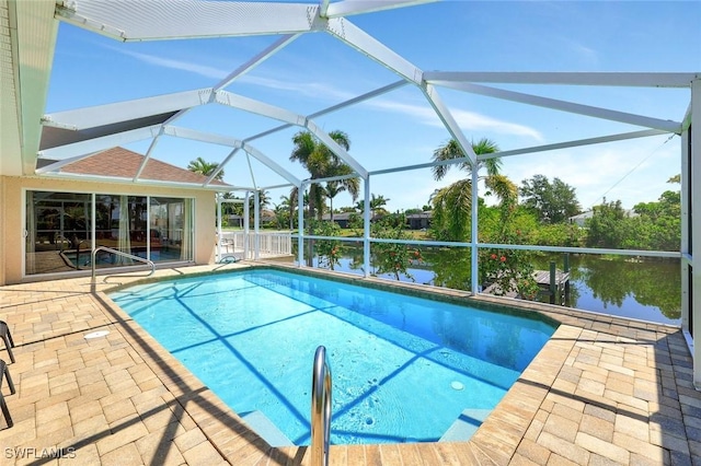 3317 SW 5th Pl, Cape Coral, FL 33914 - swimming pool with a patio area, a water view, and glass enclosure