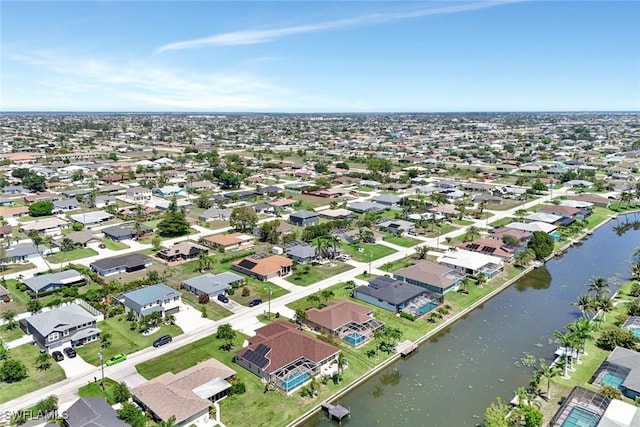 3317 SW 5th Pl, Cape Coral, FL 33914 - aerial perspective of suburban area with a large body of water