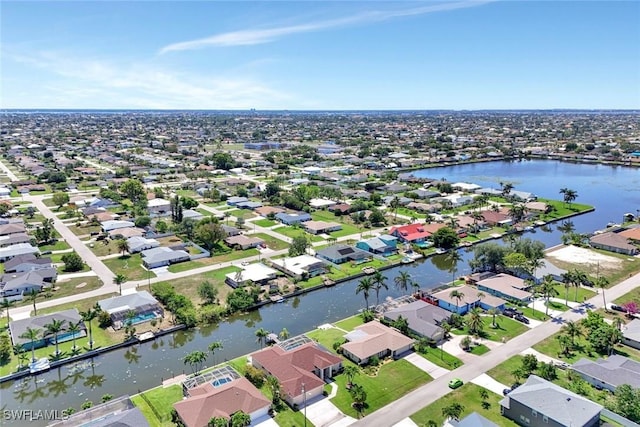 3317 SW 5th Pl, Cape Coral, FL 33914 - aerial view of property and surrounding area with nearby suburban area and a large body of water