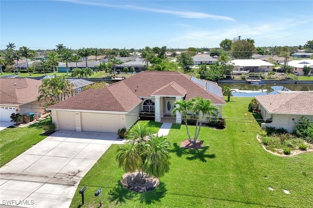 3317 SW 5th Pl, Cape Coral, FL 33914 - mediterranean / spanish house with an attached garage, concrete driveway, a residential view, and a front lawn