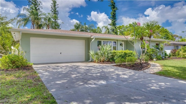 1682 S Flossmoor Rd, Fort Myers, FL 33919 - ranch-style house with stucco siding, driveway, and an attached garage