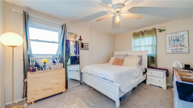 1682 S Flossmoor Rd, Fort Myers, FL 33919 - bedroom with multiple windows, light colored carpet, and a ceiling fan