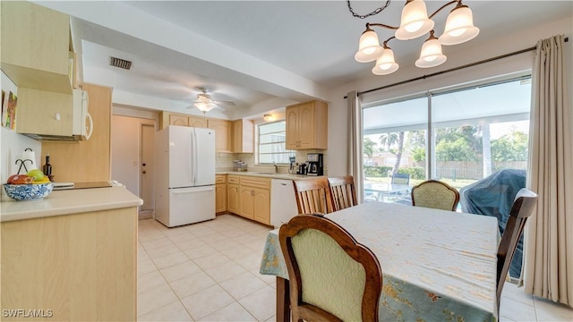 1682 S Flossmoor Rd, Fort Myers, FL 33919 - dining space with a chandelier, light tile patterned flooring, and a ceiling fan