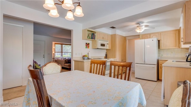 1682 S Flossmoor Rd, Fort Myers, FL 33919 - dining space featuring a chandelier, ceiling fan, and light tile patterned floors