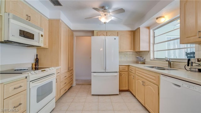 1682 S Flossmoor Rd, Fort Myers, FL 33919 - kitchen featuring white appliances, a sink, light brown cabinetry, and light countertops