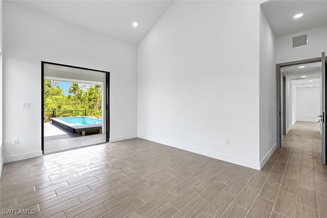 14074 Whittier Ln, Port Charlotte, FL 33981 - unfurnished room featuring wood finished floors and recessed lighting