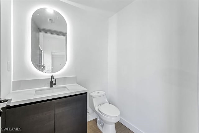 14074 Whittier Ln, Port Charlotte, FL 33981 - bathroom featuring vanity and wood finished floors