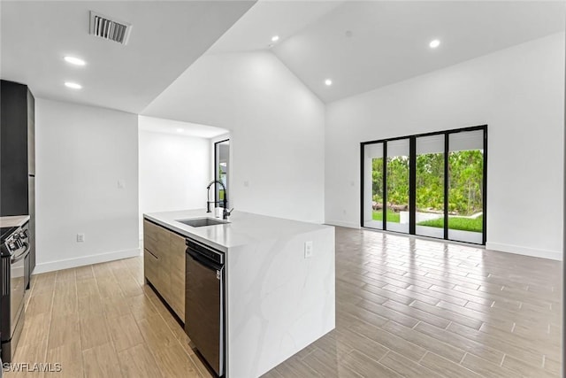 14074 Whittier Ln, Port Charlotte, FL 33981 - kitchen featuring dishwashing machine, open floor plan, high vaulted ceiling, modern cabinets, and light countertops