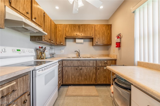 1830 Brantley Rd Unit A2, Fort Myers, FL 33907 - kitchen featuring white range with electric stovetop, a sink, under cabinet range hood, light countertops, and recessed lighting