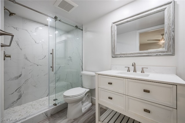 1830 Brantley Rd Unit A2, Fort Myers, FL 33907 - full bath featuring toilet, a marble finish shower, vanity, and wood finished floors
