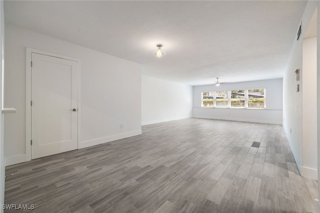 1830 Brantley Rd Unit A2, Fort Myers, FL 33907 - unfurnished living room with wood finished floors and baseboards