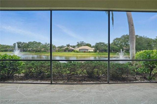 878 Vistana Cir Unit 50, Naples, FL 34119 - unfurnished sunroom featuring a water view
