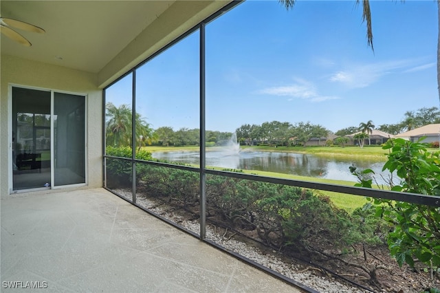 878 Vistana Cir Unit 50, Naples, FL 34119 - unfurnished sunroom with a water view and ceiling fan